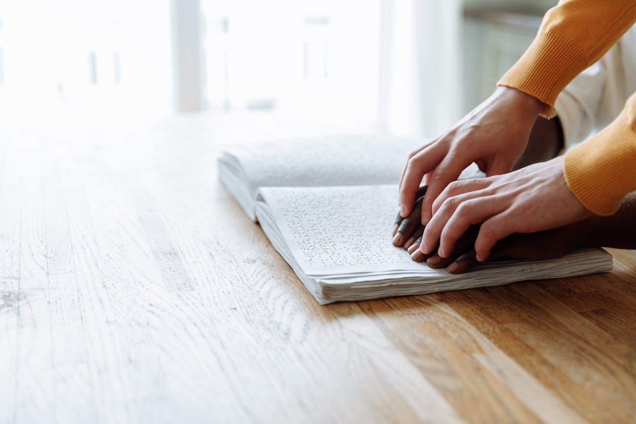 A Person Reading Braille