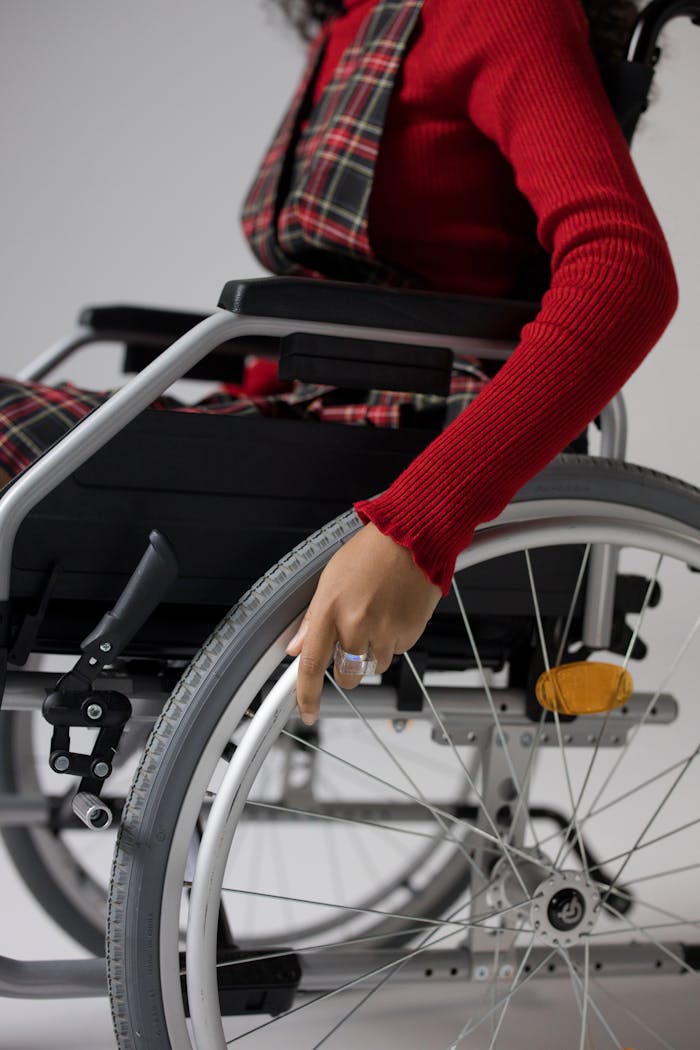 Woman in Red Longsleeve Sitting in Wheelchair